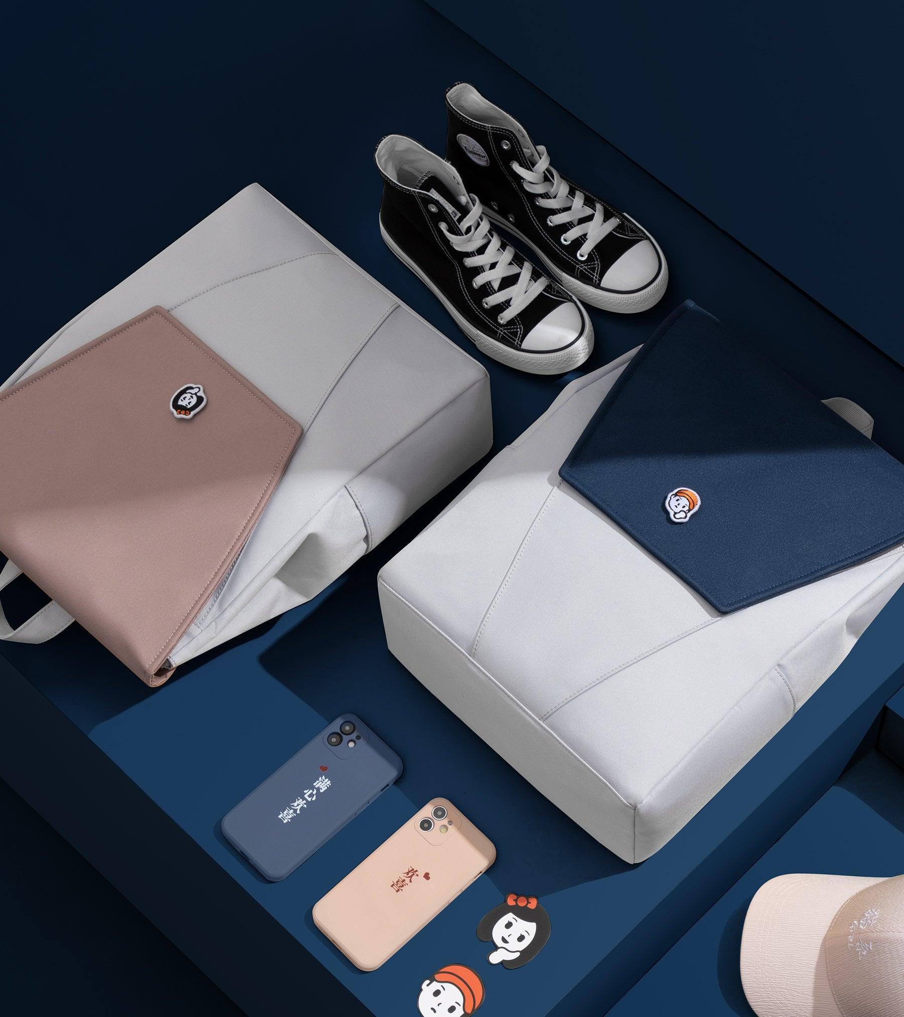 Stylish backpacks with character patches, paired with sneakers and phone cases on a navy backdrop.