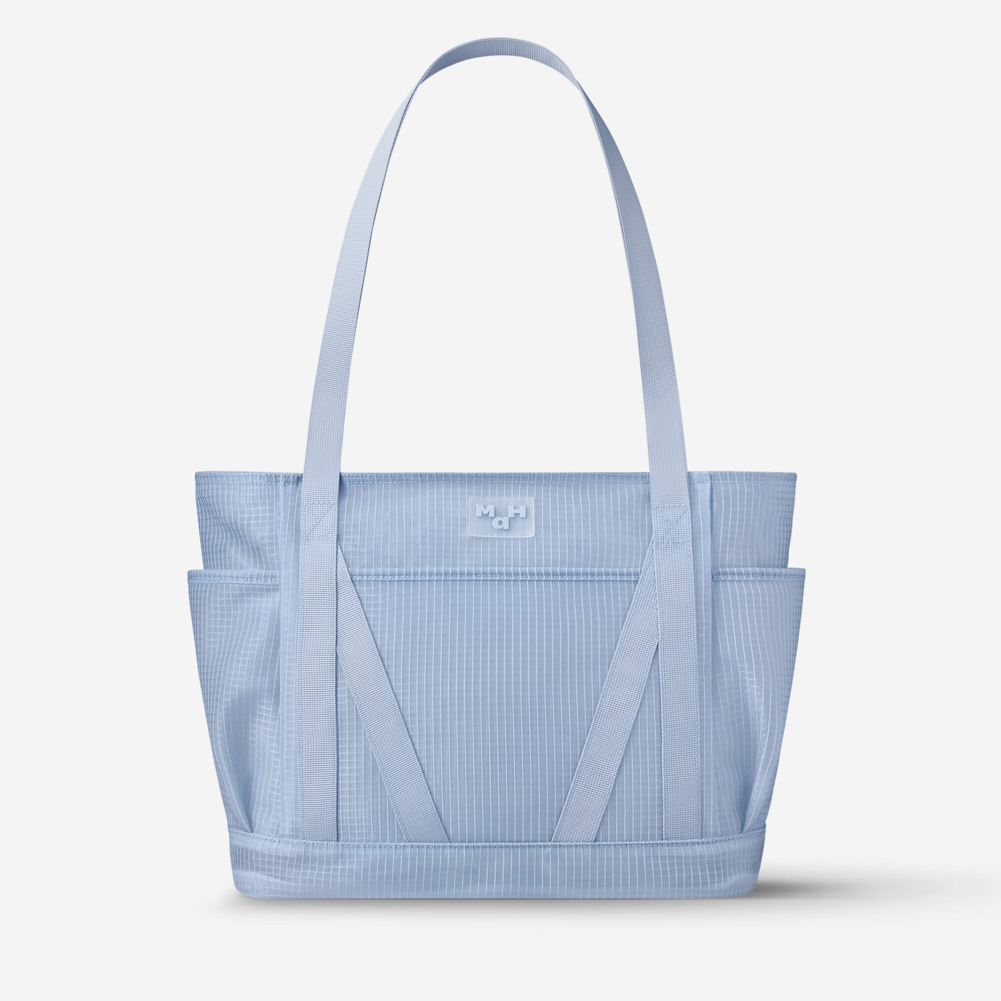 Light blue grid-pattern tote bag with dual straps and front pockets, ideal for everyday carry.