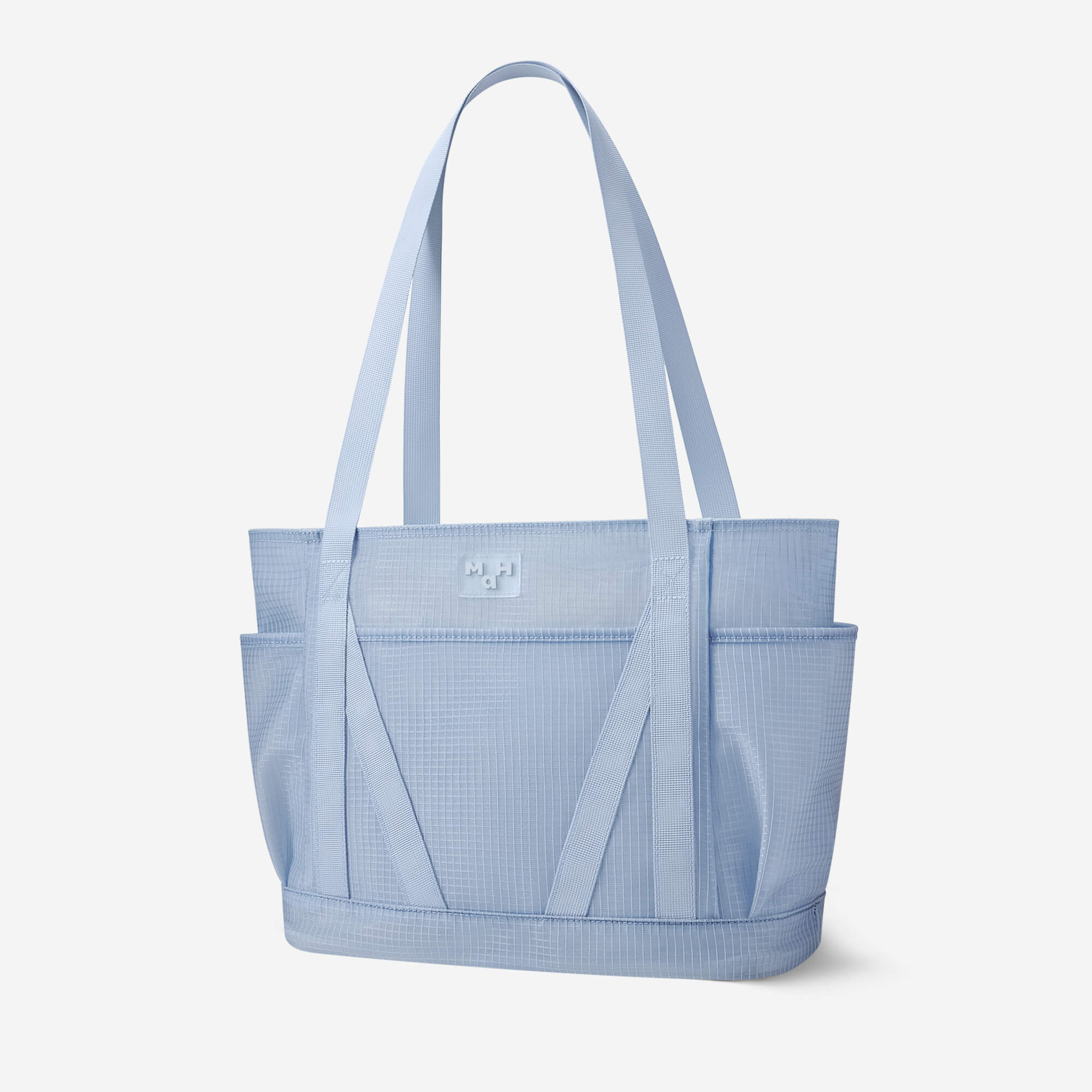 Light blue grid-pattern tote bag with dual straps and front pockets, ideal for everyday carry and lifestyle use.