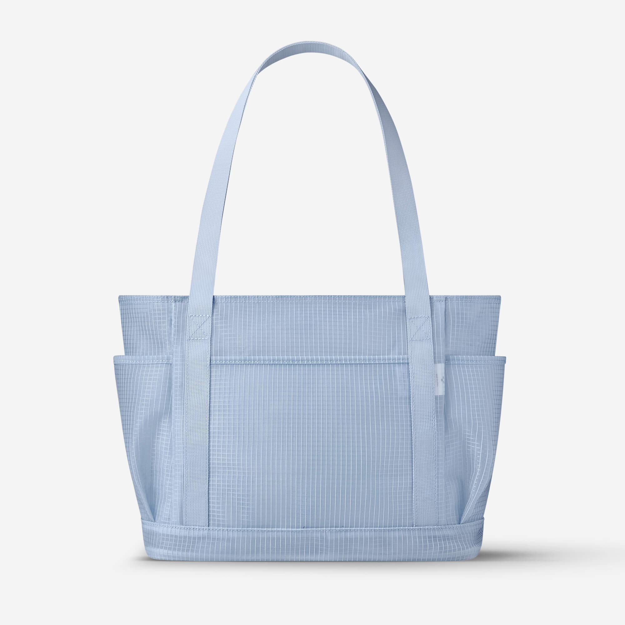 Light blue grid-patterned tote bag with side pockets and sturdy handles, ideal for everyday use.