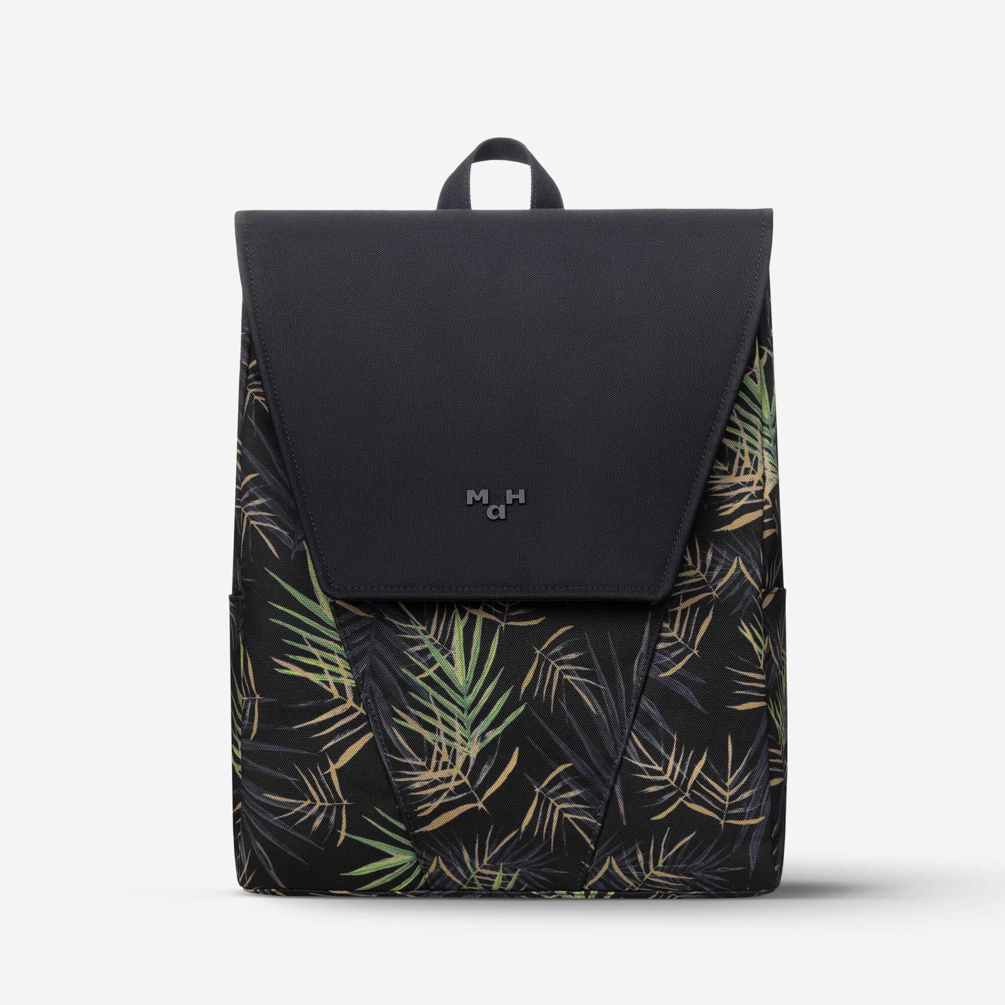 Black backpack with tropical leaf print and front flap, ideal for everyday use and travel