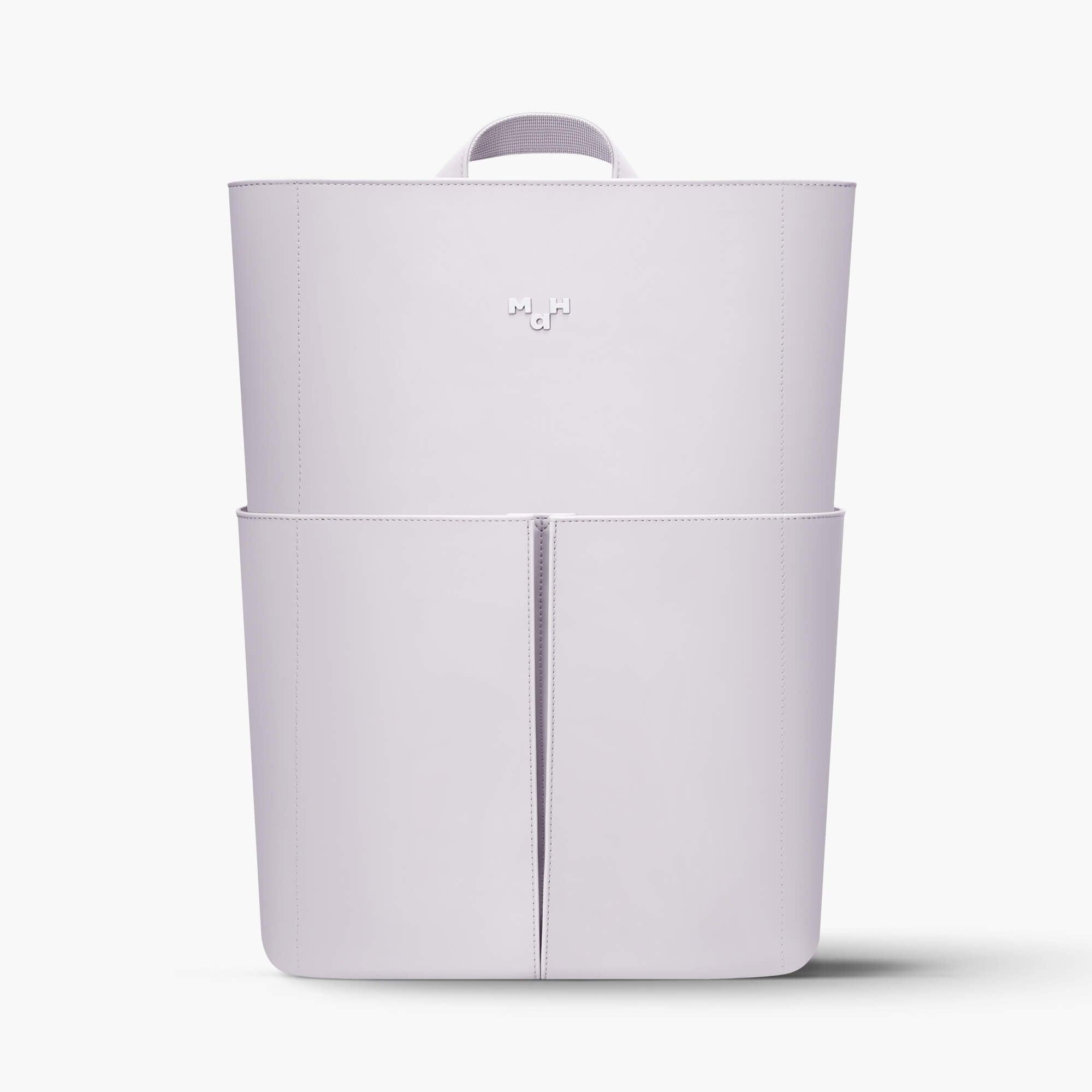 Minimalist white backpack with top handle and front pocket, sleek design for everyday use