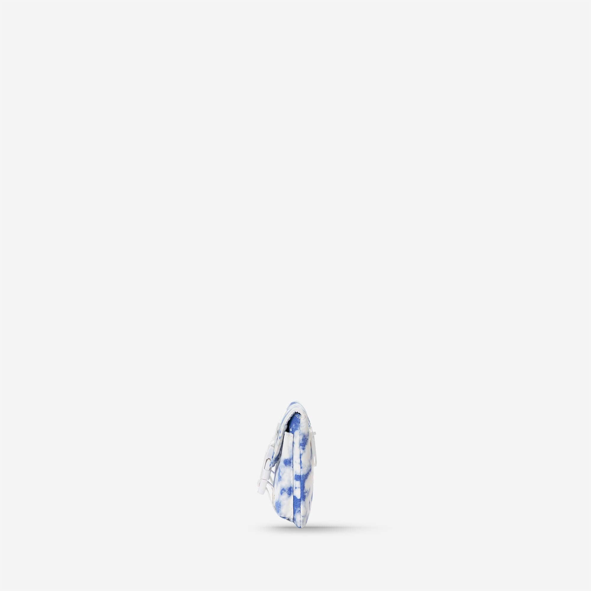 Blue and white tie-dye mini crossbody bag with adjustable strap, stylish accessory for everyday use