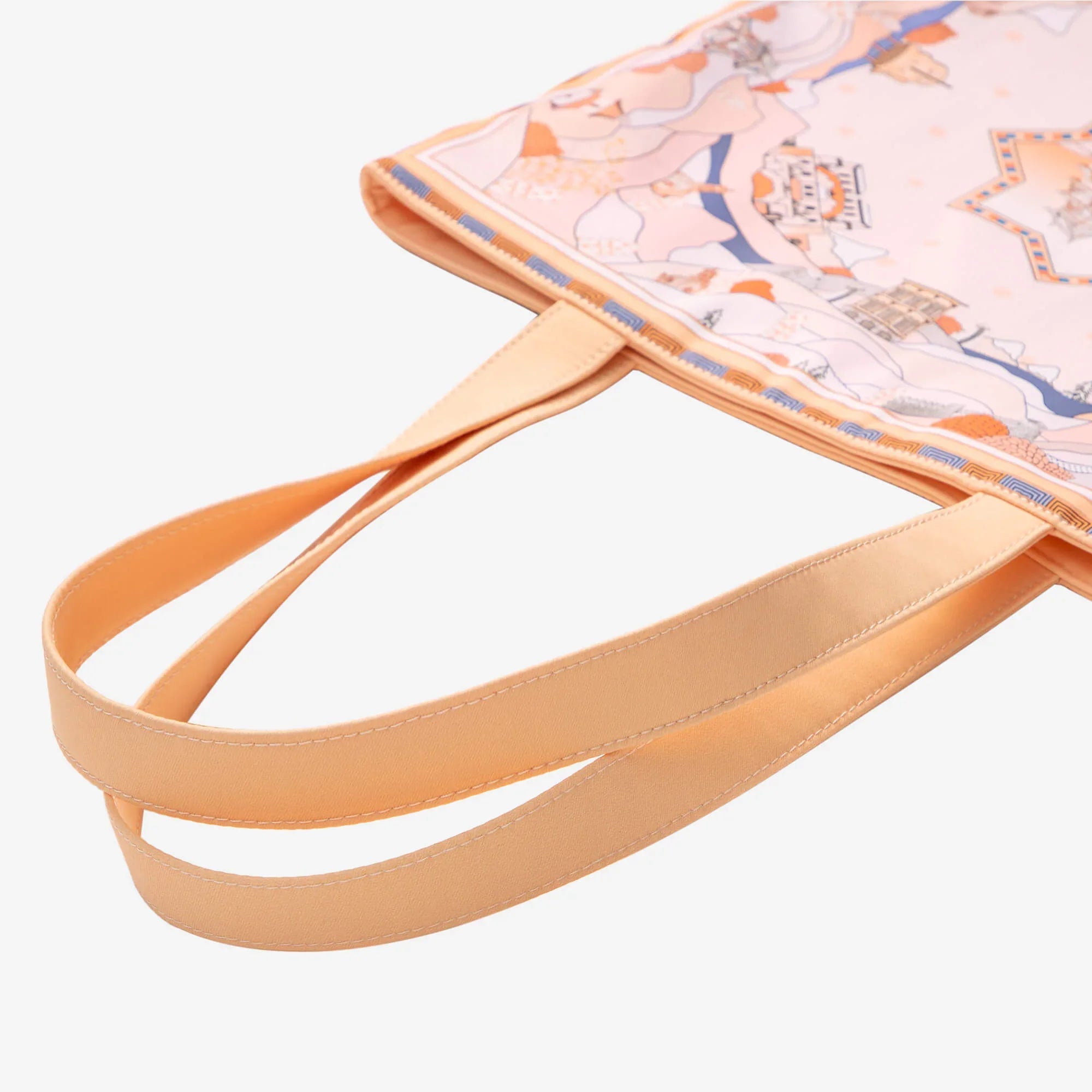 Stylish tote bag with pastel map print and peach straps, perfect for everyday carry and travel essentials.