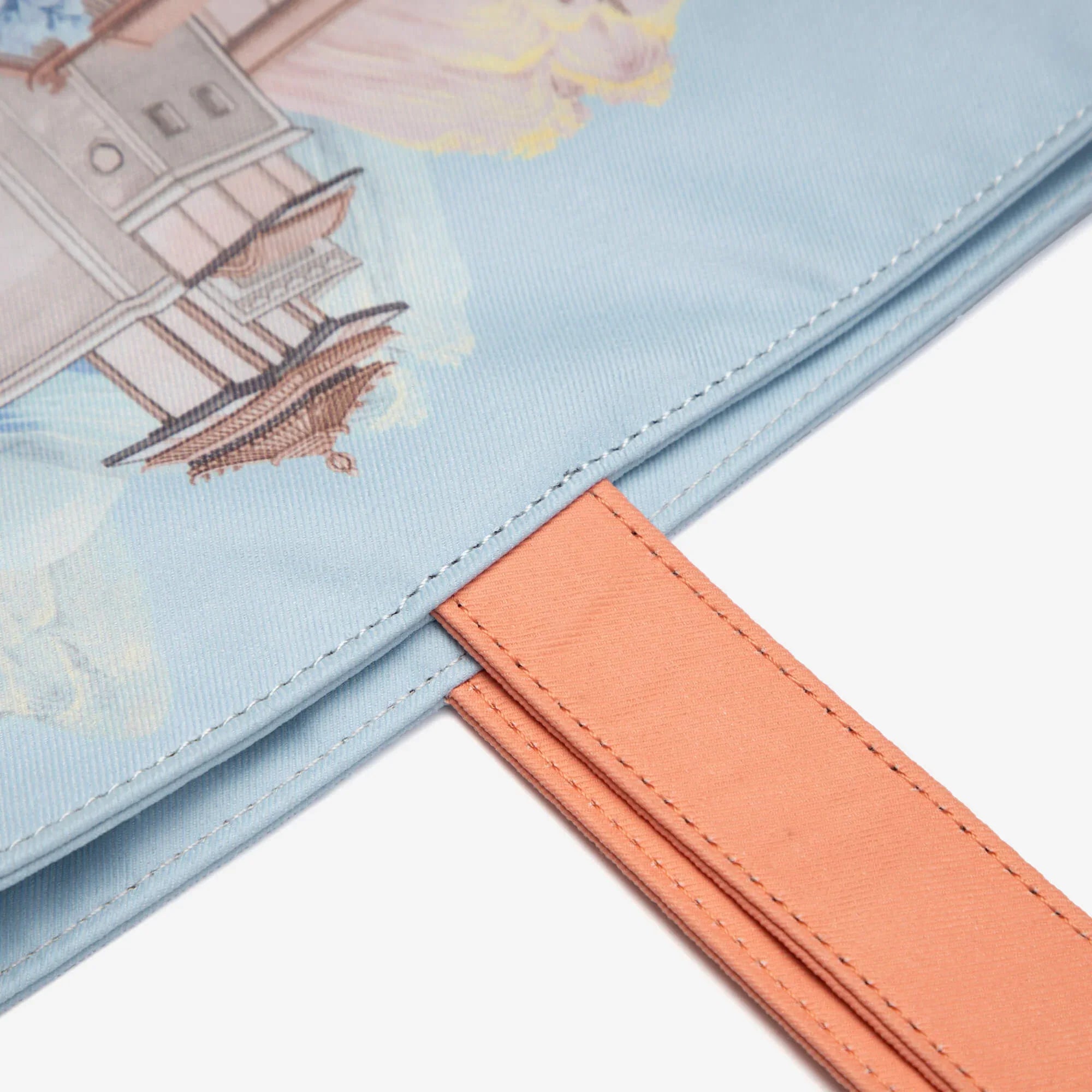 Light blue tote bag with vintage ship print and peach strap, stylish everyday accessory
