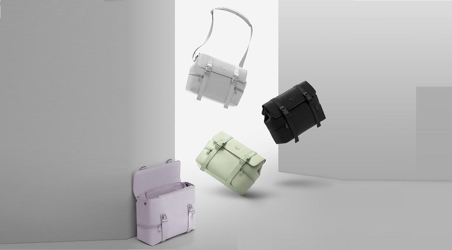 Stylish minimalist crossbody bags in pastel and black, featuring sleek design and functional straps for everyday use.
