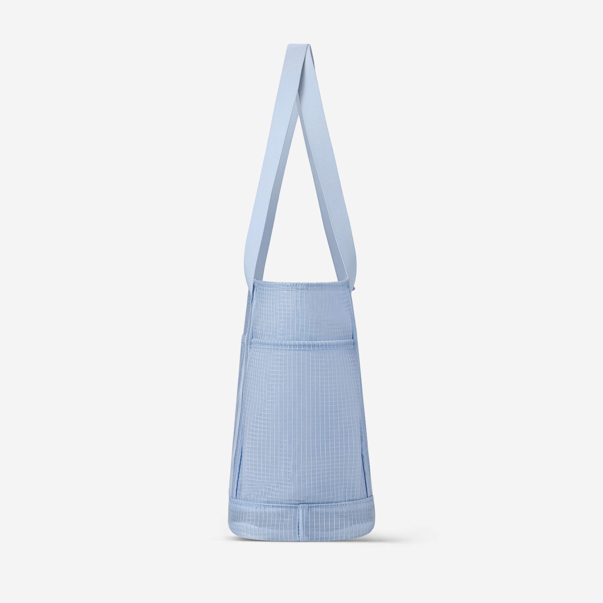 Light blue grid-patterned tote bag with long shoulder strap, minimalist design for everyday use