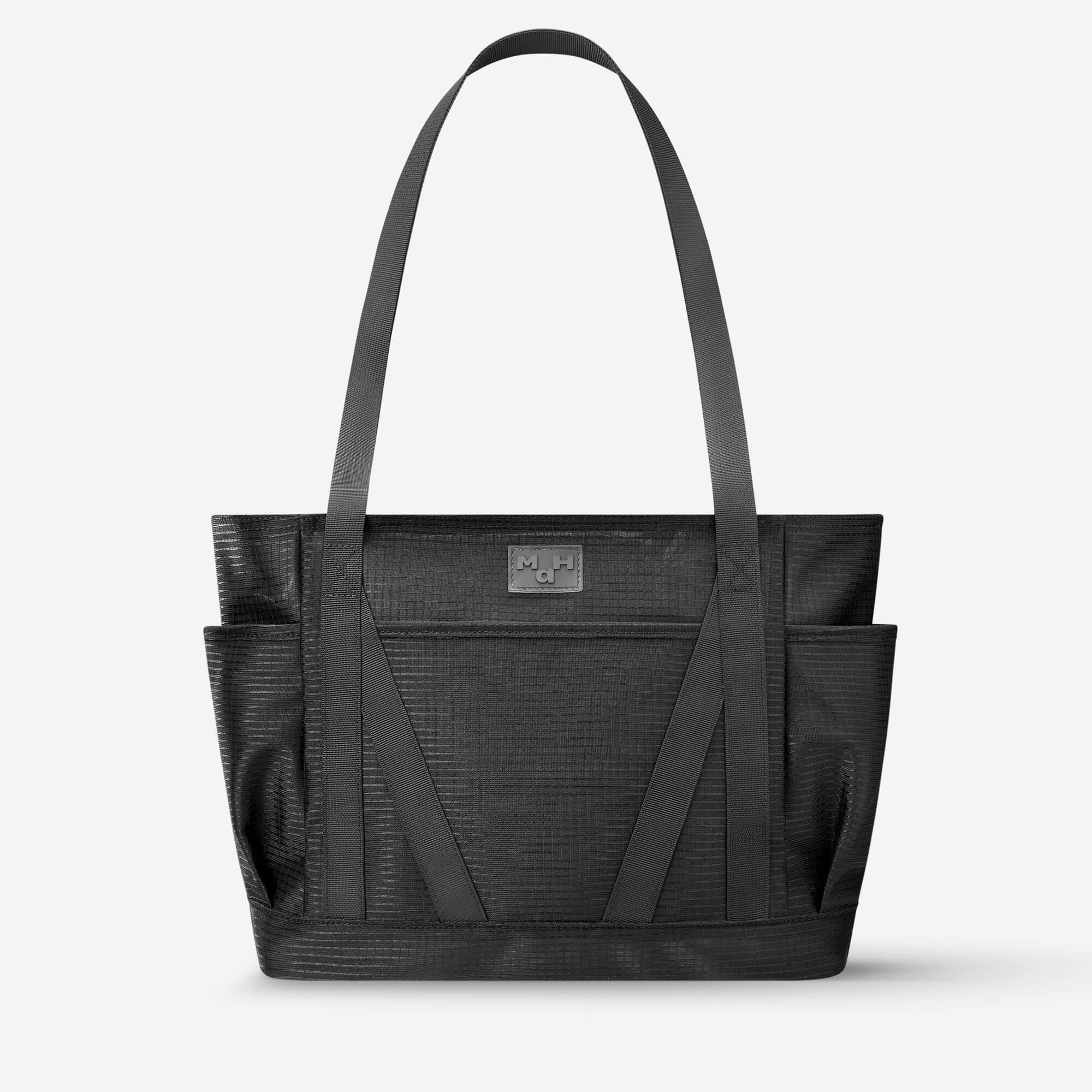 Black textured tote bag with dual straps and front pockets, ideal for daily use or travel