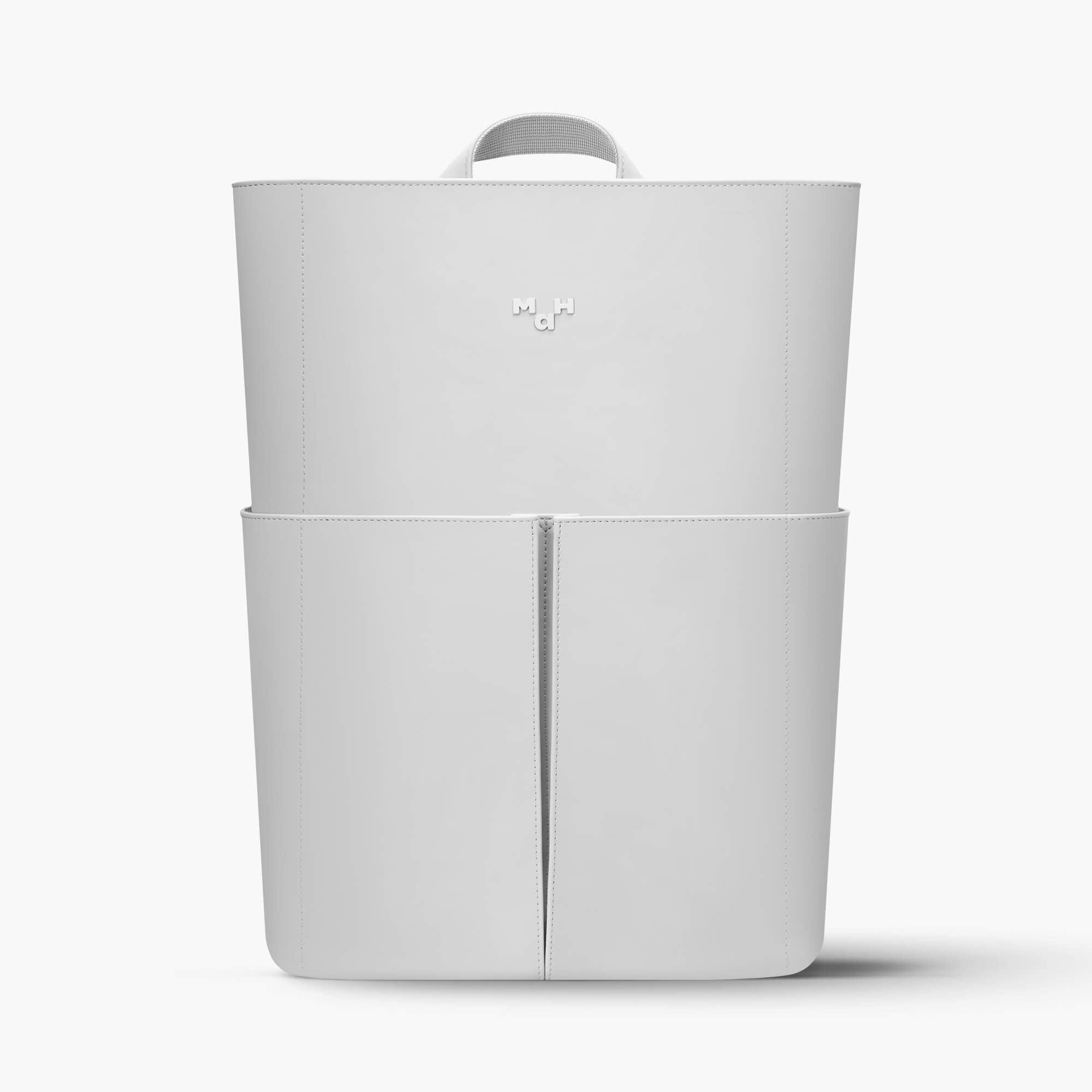 Minimalist white backpack with top handle and front zipper, sleek design for everyday use