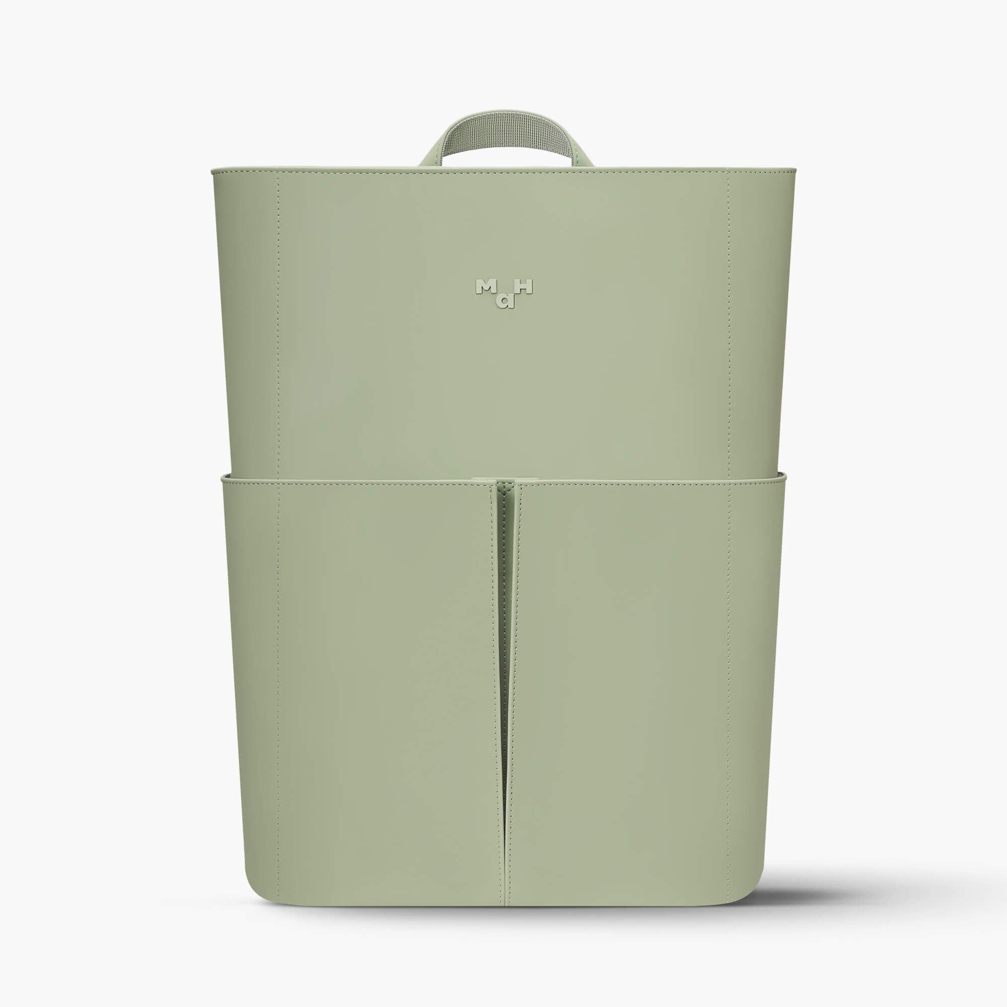 Sage green minimalist backpack with top handle and front pocket, sleek design for everyday use