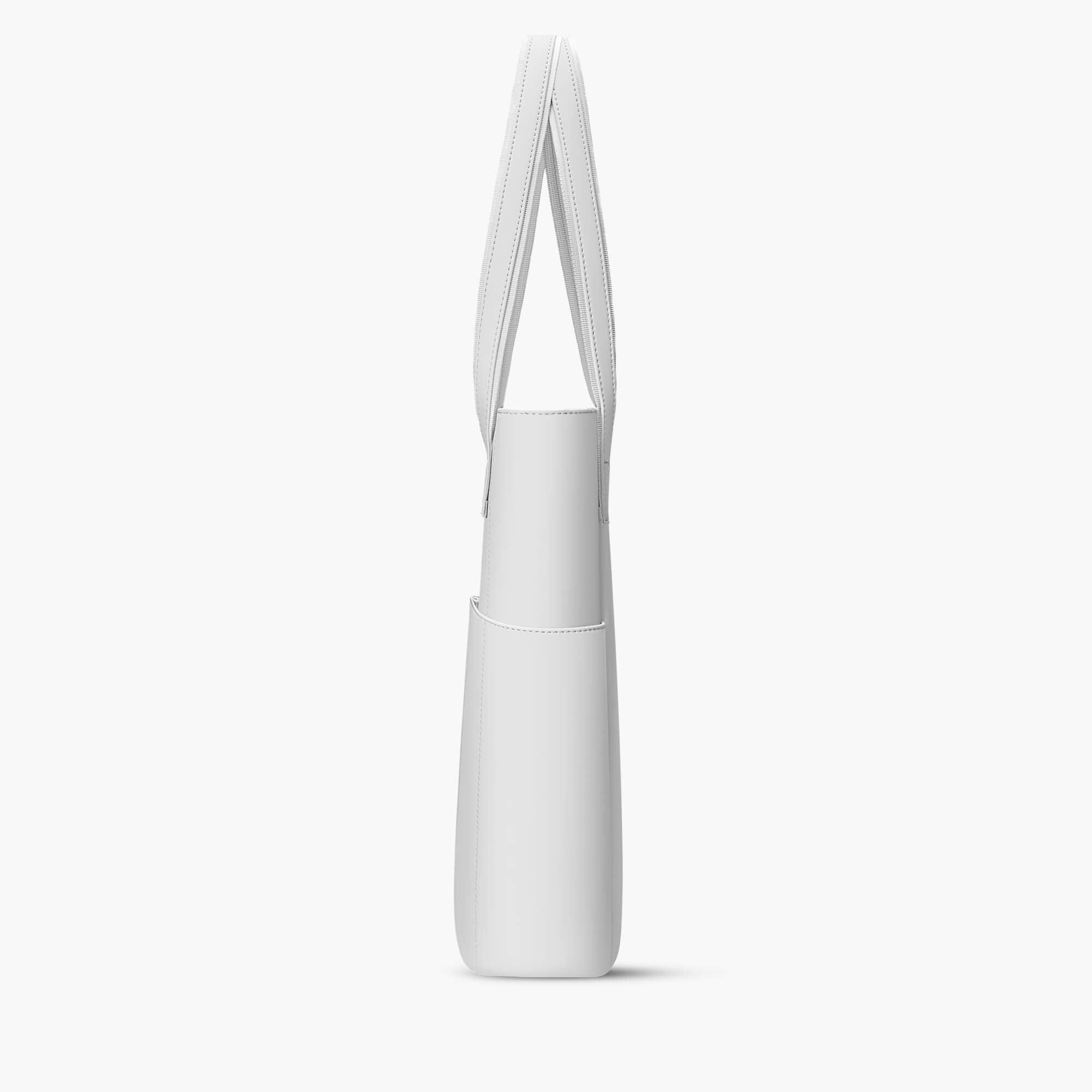 Minimalist white tote bag with shoulder strap and side pocket, sleek design for everyday use