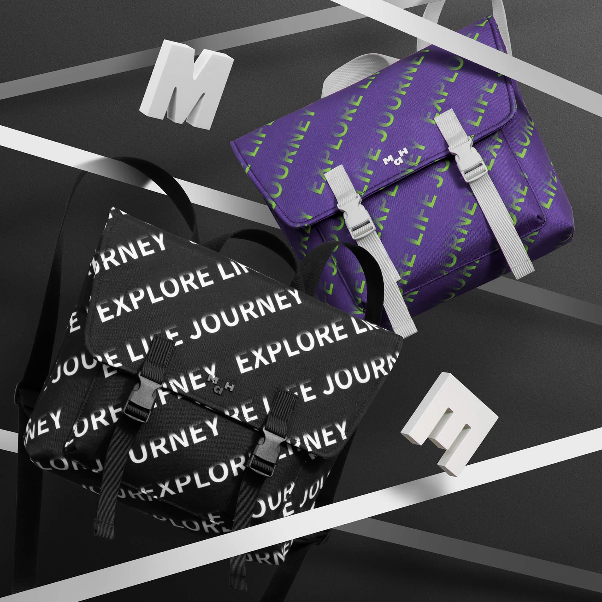 Purple and black 'Explore Life Journey' print backpacks with bold graphic design and adjustable straps