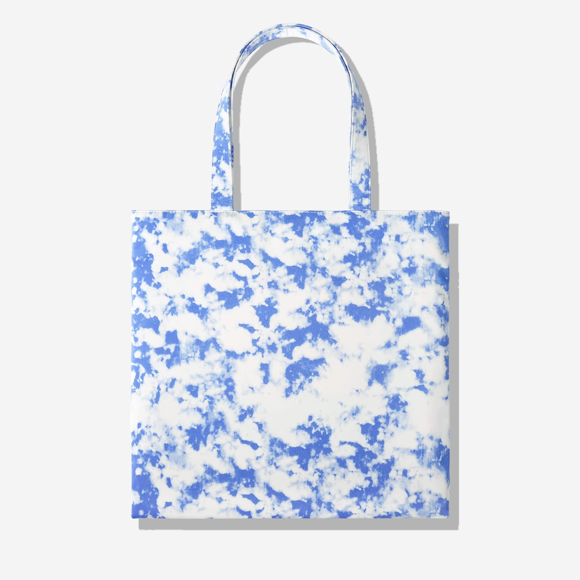 Blue and white tie-dye tote bag with cloud pattern, stylish everyday carry accessory
