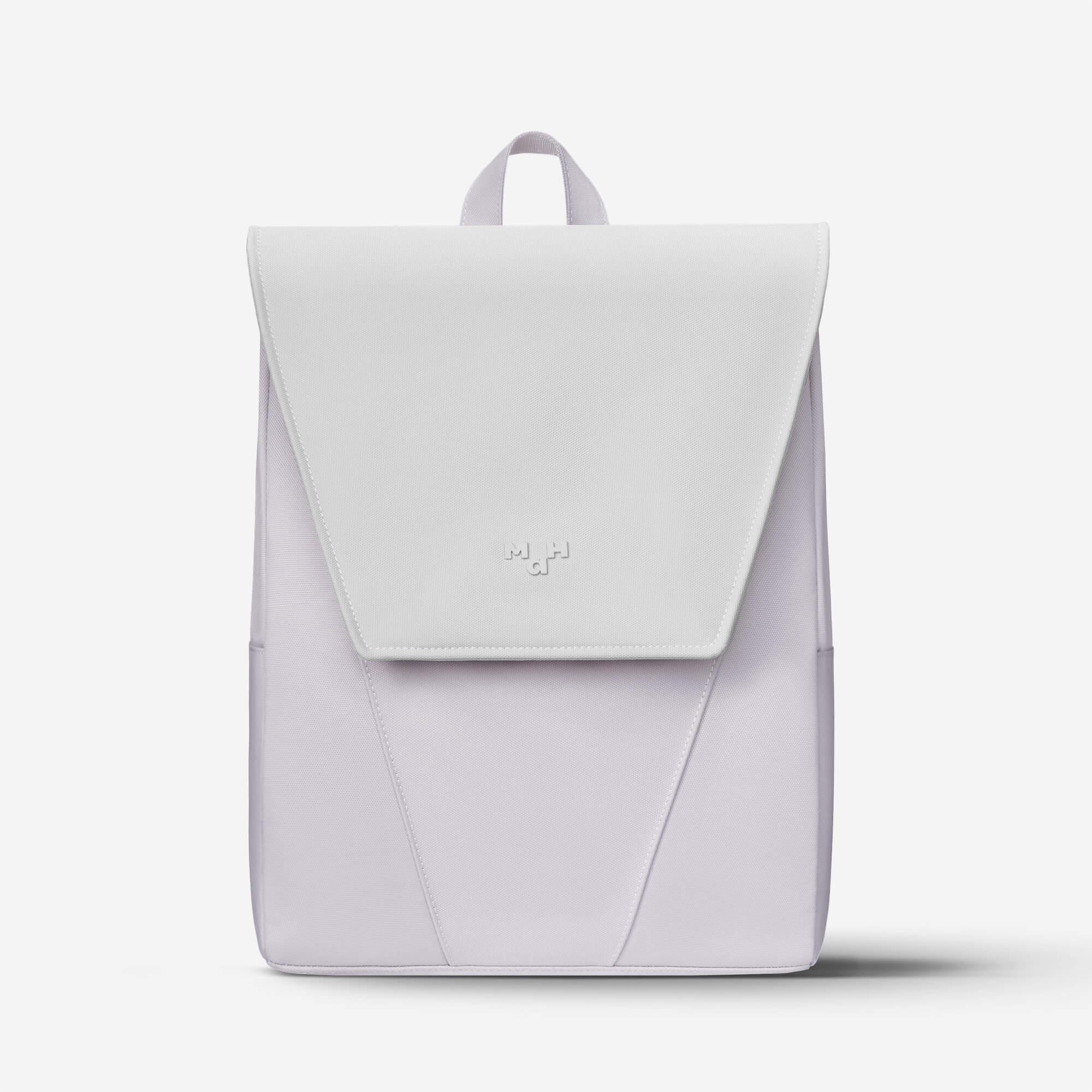 Minimalist lavender and white backpack with flap closure and subtle logo, ideal for daily use or travel.