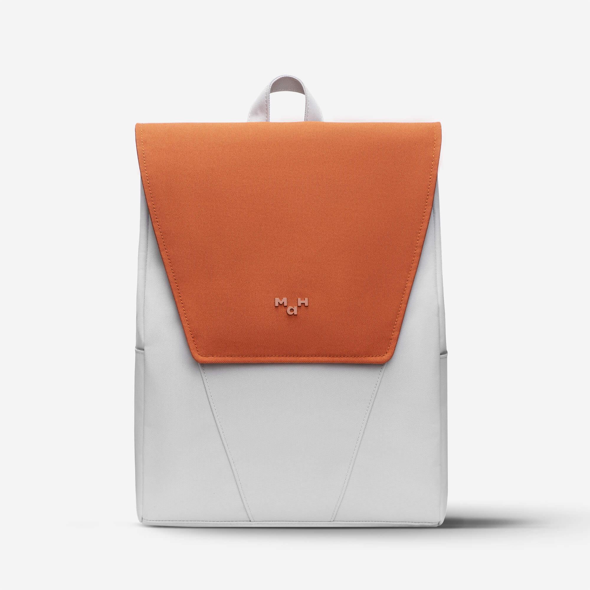 Modern orange and gray backpack with minimalist design and front flap closure