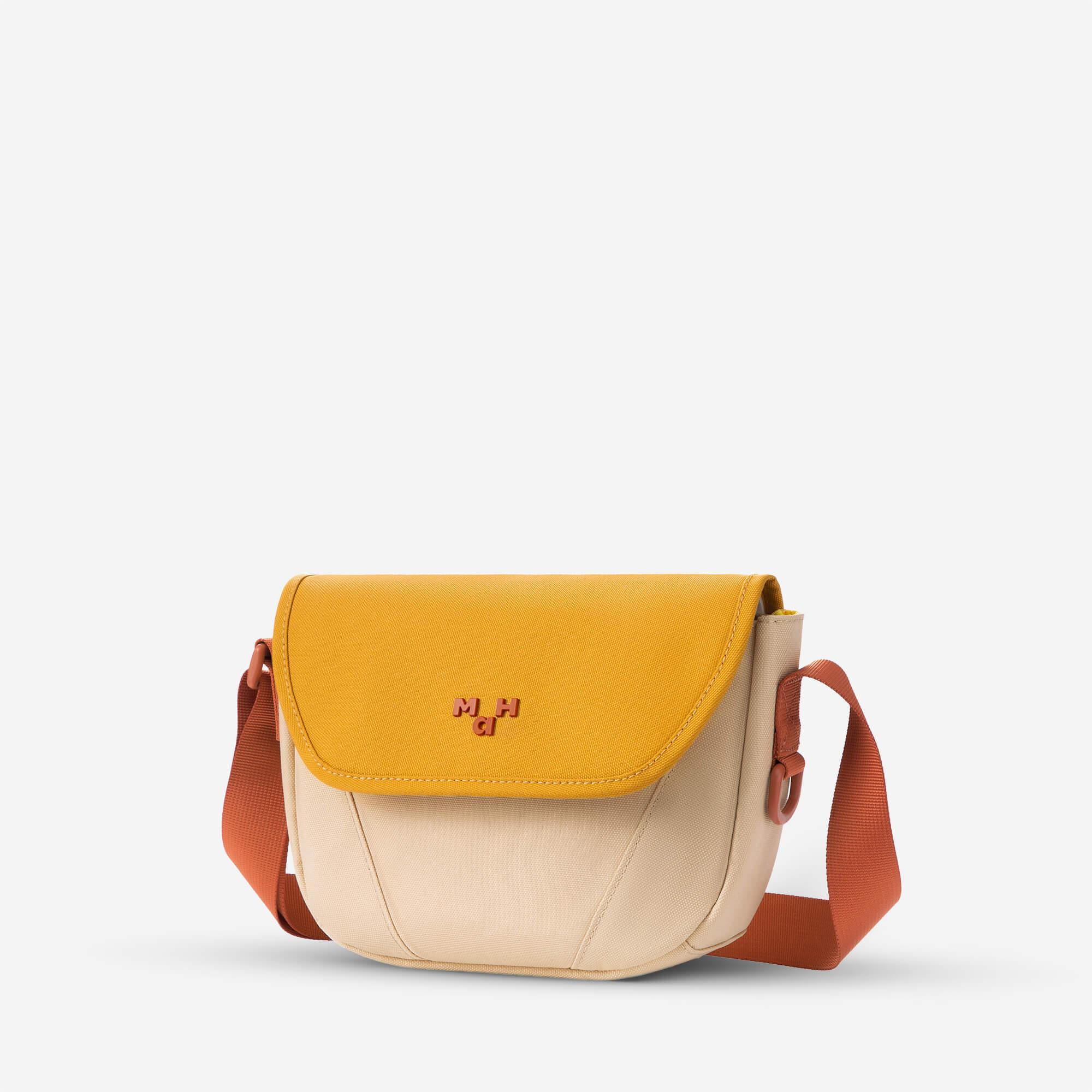 Mustard yellow and beige crossbody bag with orange strap and logo detail, stylish everyday accessory