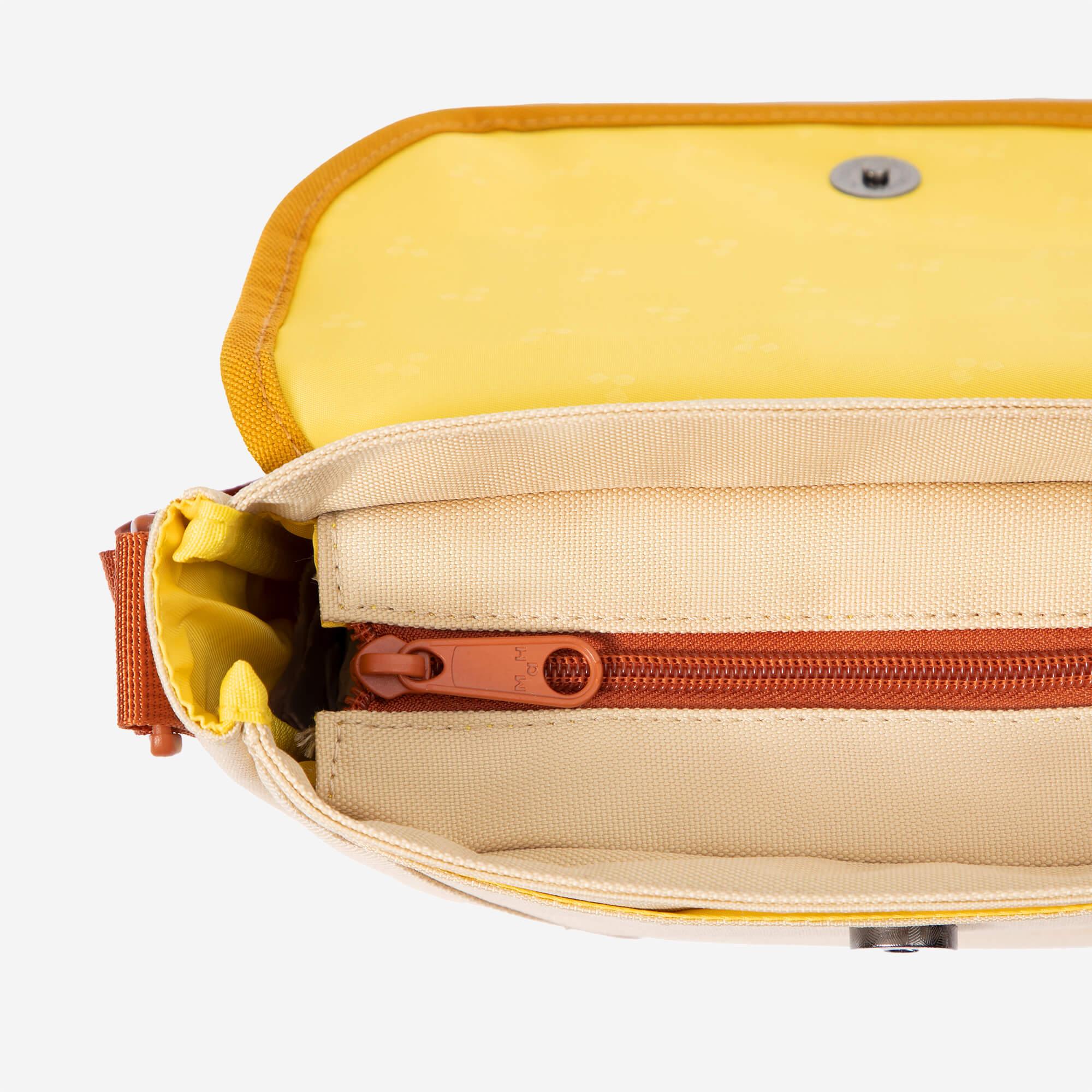 Yellow and beige crossbody bag with orange zipper, interior pocket, and snap closure